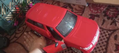 RANGE ROVER RED RC CAR WITH STEERING WHEEL CONTROLLER