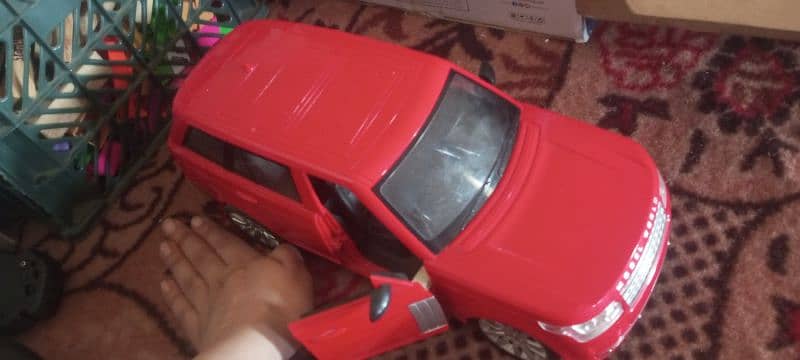 RANGE ROVER RED RC CAR WITH STEERING WHEEL CONTROLLER 0