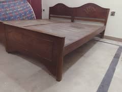 Two single wooden bed