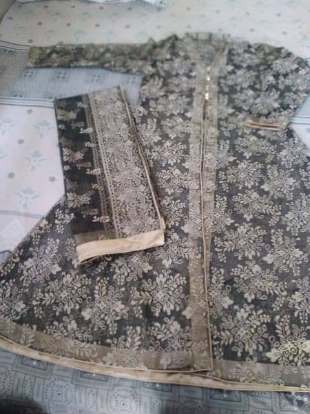 Net gaon with inner shirt and net dupatta and silk trouser. 1