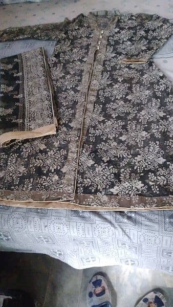 Net gaon with inner shirt and net dupatta and silk trouser. 2