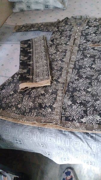 Net gaon with inner shirt and net dupatta and silk trouser. 3