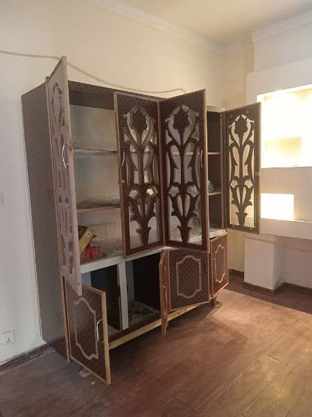 A beautiful closet for keeping heavy crockery and kitchen material. 1
