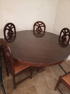 Home used neat and clean dinning table with chairs