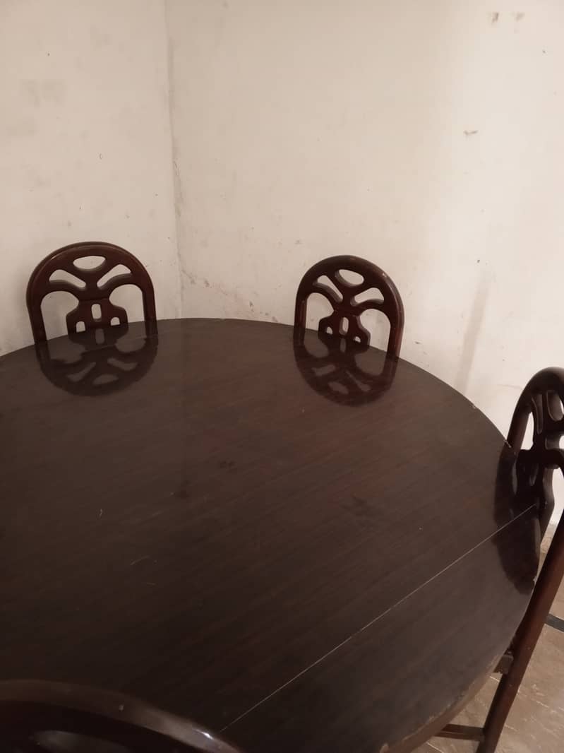 Home used neat and clean dinning table with chairs 2