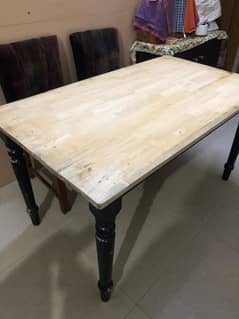 Table with barmatic original wood chairs