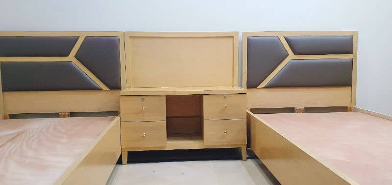 Single bed pair along with table 1