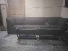 two seater sofa with two center tables.