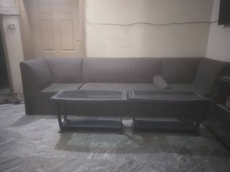 two seater sofa with two center tables. 0