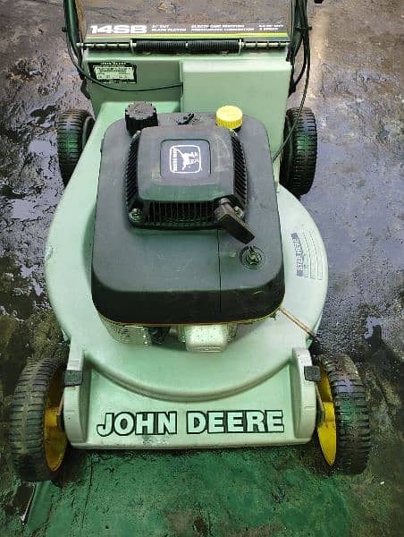 lawnmower grass cutting machine petrol engine John dear USA 13