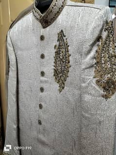 new sherwani , off-white in color
