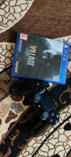 PS4 Pro controller orignal and resident evil village game disc