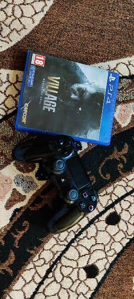 PS4 Pro controller orignal and resident evil village game disc 1