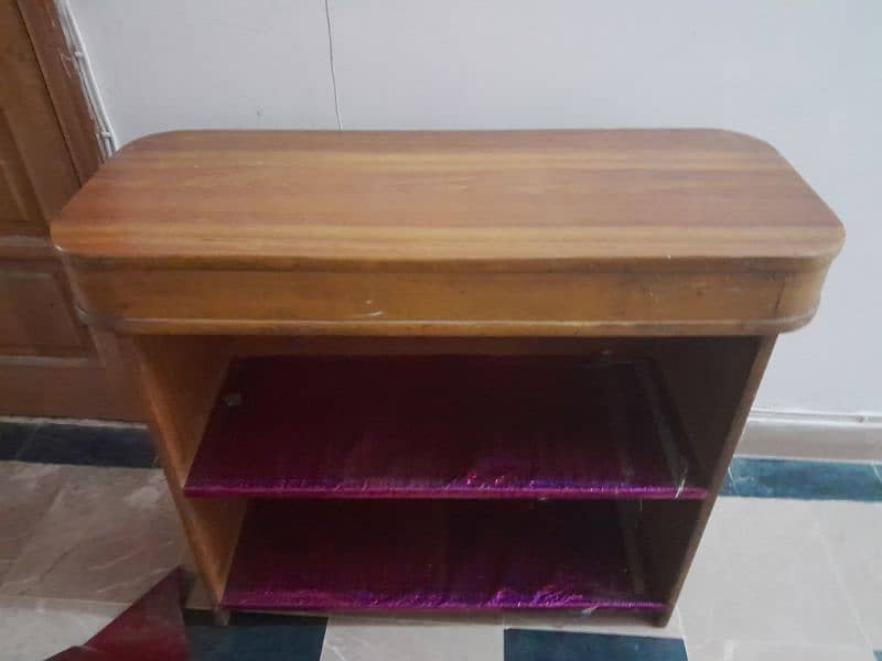 Durable and good looking wooden study table with books keeping space 0