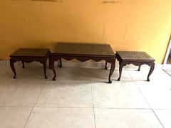 Set of one large center table and two side tables