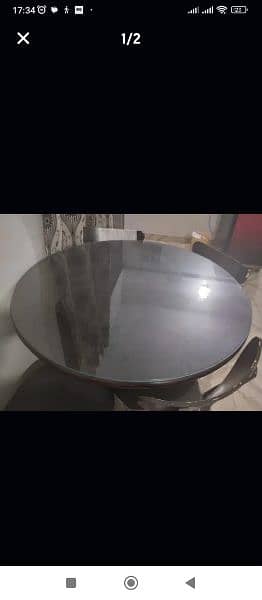 Round dining table with three chairs for sale. 1
