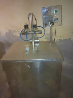 Engine oil filling and juice filling machine