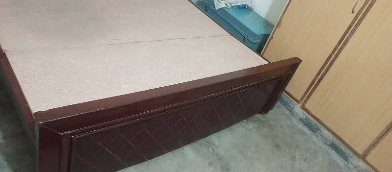 wooden bed. 1