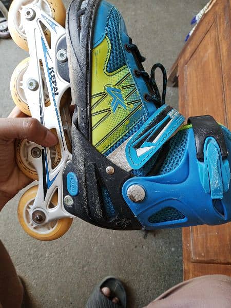 Two Pairs of Skating Shoes with RGB wheels and Adjustable sizes . 2