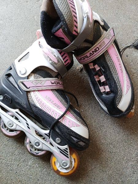 Two Pairs of Skating Shoes with RGB wheels and Adjustable sizes . 5