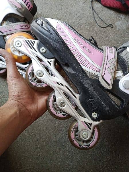 Two Pairs of Skating Shoes with RGB wheels and Adjustable sizes . 6