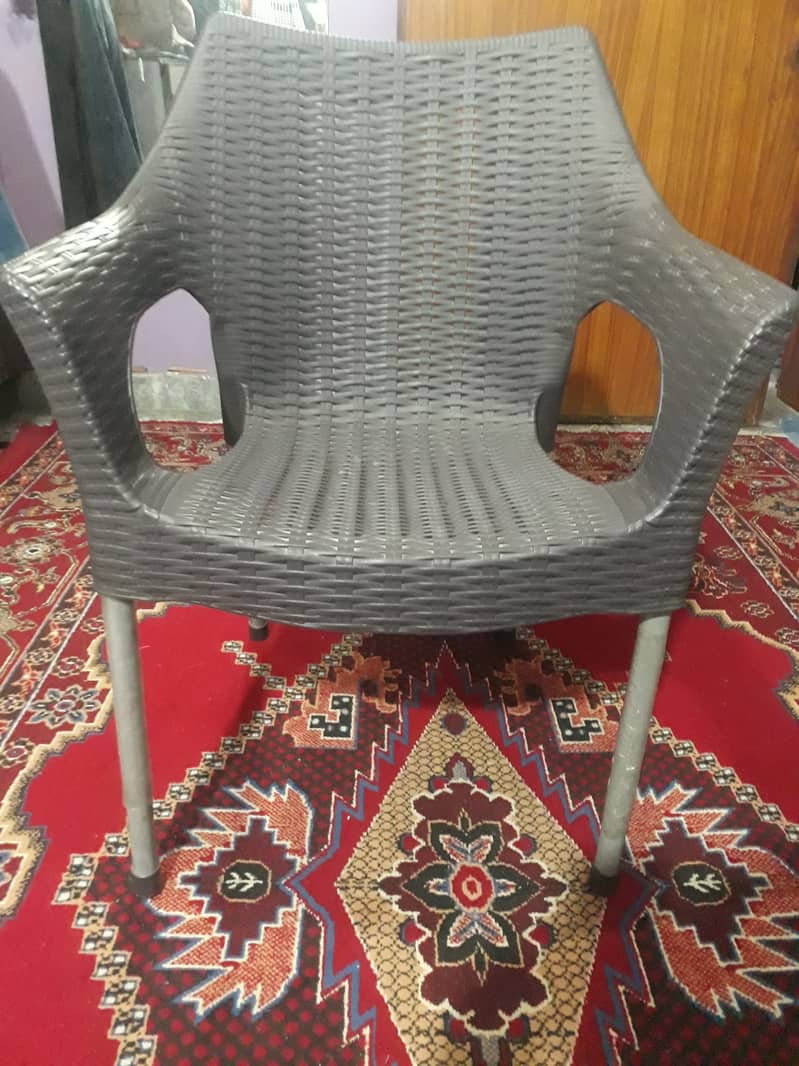 Plastic chairs and table for sale 0