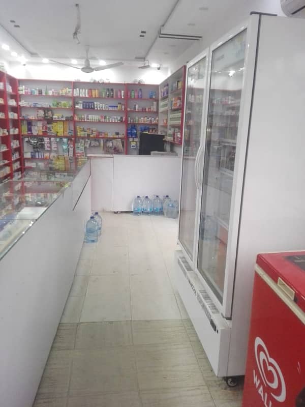5 Marla Triple Storey Commercial Property For Sale Corner Plot Of Street Including Residential Flats Plus Running Business Of Pharmacy. 4