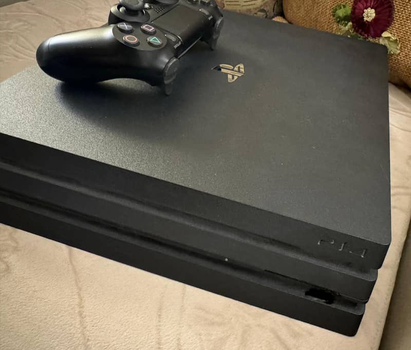 PlayStation 4 Pro 1 TB with One Remote 0
