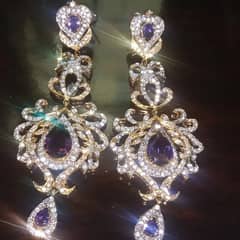 purple and gold  designer earrings.