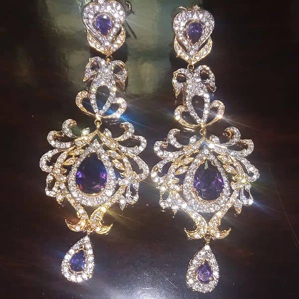 purple and gold  designer earrings. 1