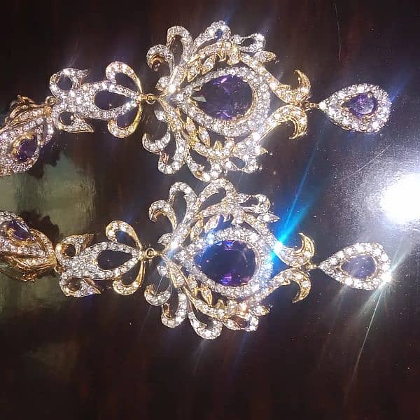 purple and gold  designer earrings. 2