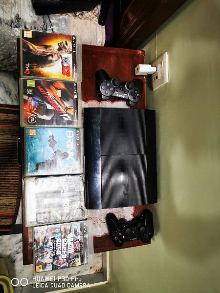 PS3 SUPER SLIM 2remote controler WITH 5 GAMES FREE 0