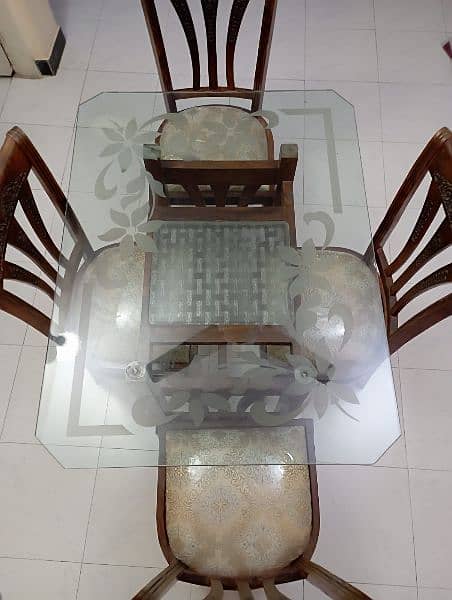 Glass top dinning table with four chairs 2