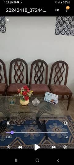 a very beautiful dinning table with 4 chairs