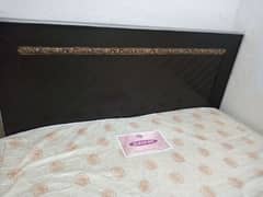 wood king size bed with mattress.