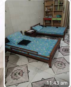 Two single iron bed