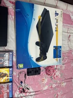 Sony Play Station 4 with games and three controllers 0
