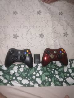 two xbox 360 controllers