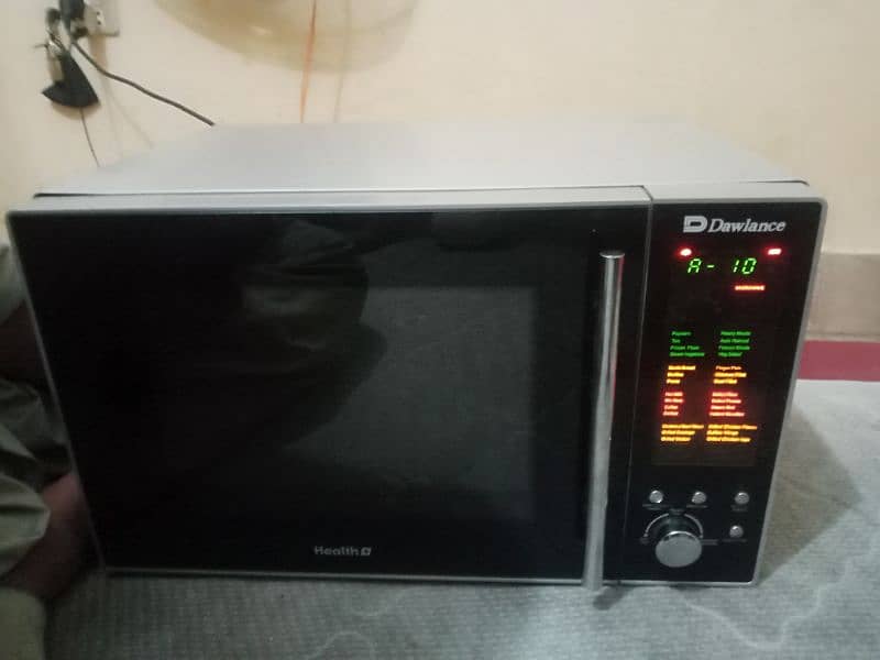 like new big size microwave Dawlance with LCD panal 0