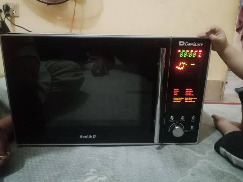 like new big size microwave Dawlance with LCD panal 7