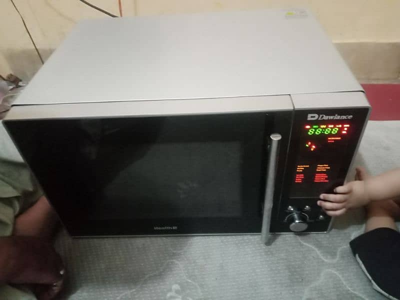 like new big size microwave Dawlance with LCD panal 8