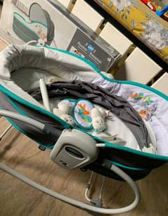 Mastella 5 in 1 rocker bassinet. . . 

With music and mosquito net. .