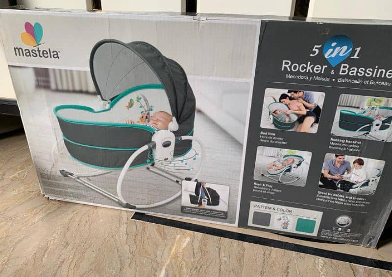 Mastella 5 in 1 rocker bassinet. . . 

With music and mosquito net. . 2