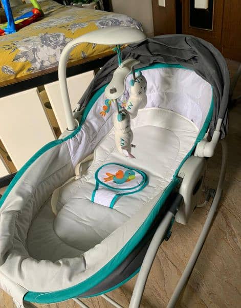 Mastella 5 in 1 rocker bassinet. . . 

With music and mosquito net. . 5