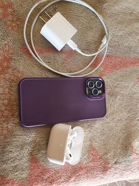 iphone 12 pro with earbuds and charger 7