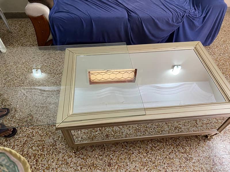 5 sides mirror glass centre table. 2