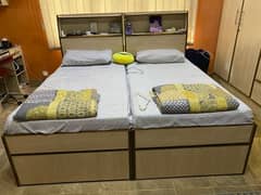 light brown single beds with drawers
