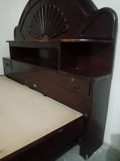 kikar  wooden bed with spring mattress useful in good condition