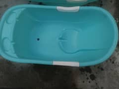 Baby bath tub and baby cot