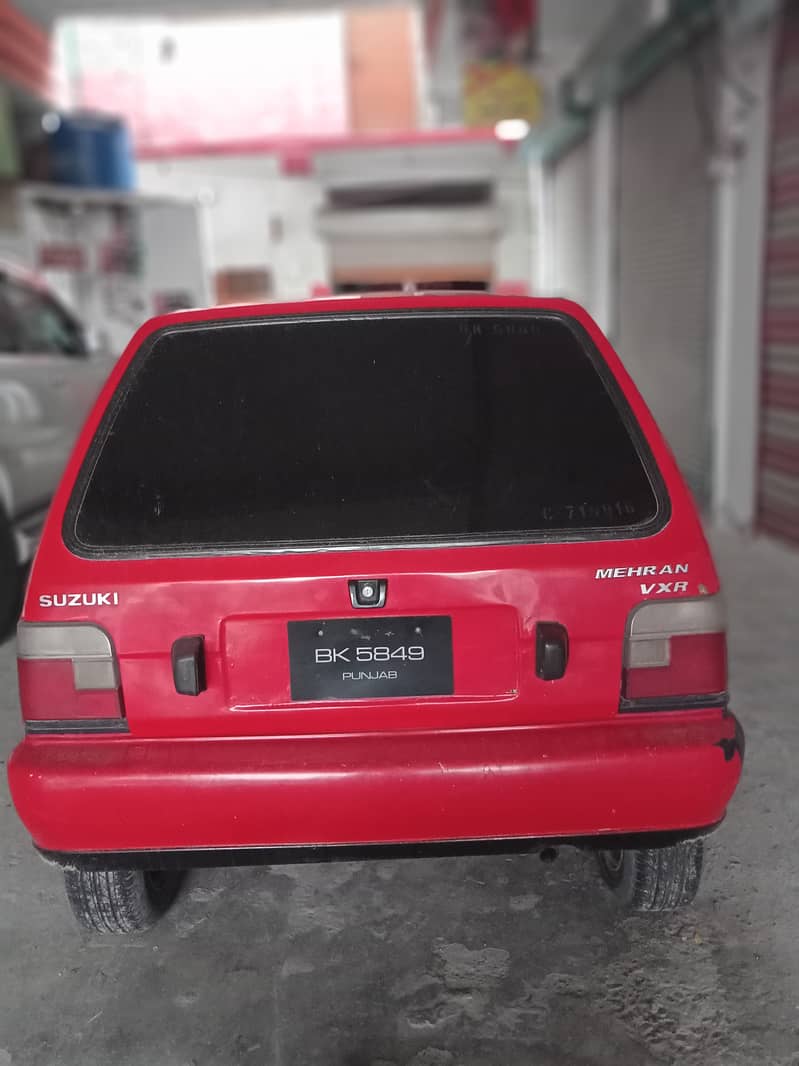 Mehran Suzuki model 1998 coular red number register Punjab 4